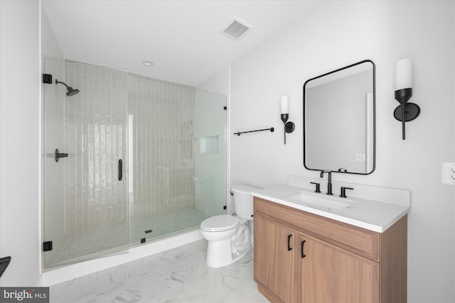 bathroom featuring vanity, an enclosed shower, and toilet