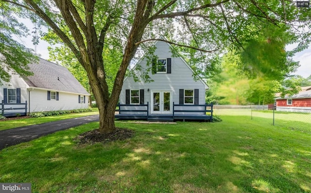 view of front of property with a front lawn and french doors