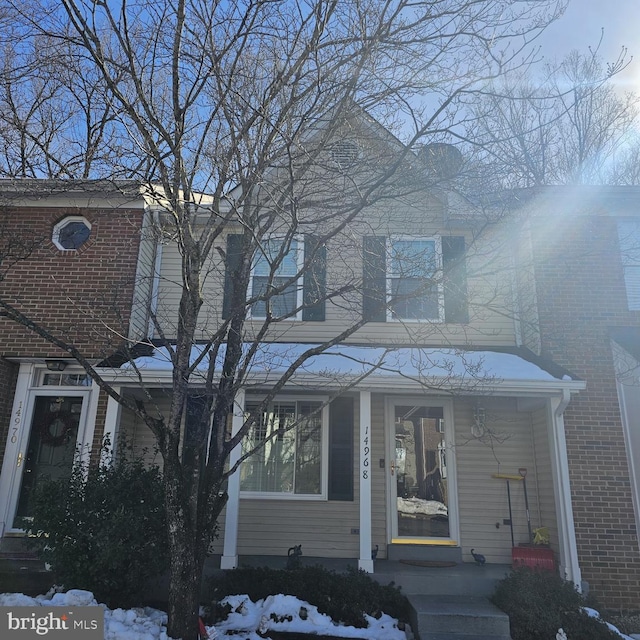 view of front of property featuring brick siding