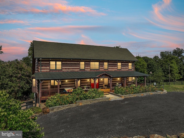 log cabin with a porch