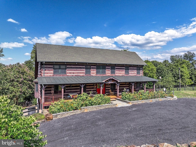 cabin featuring covered porch