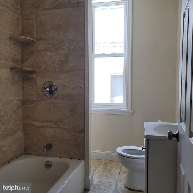 full bathroom featuring vanity, toilet, and tiled shower / bath combo