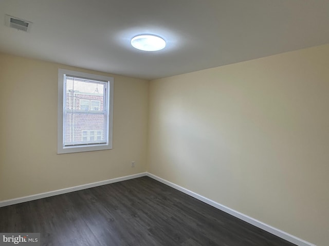 empty room featuring dark hardwood / wood-style floors