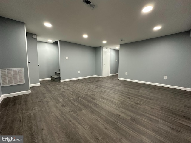 basement featuring dark wood-type flooring