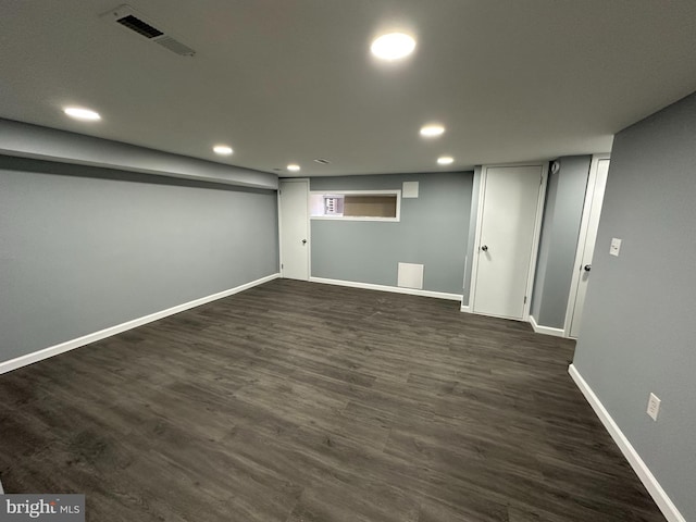 basement featuring dark wood-type flooring