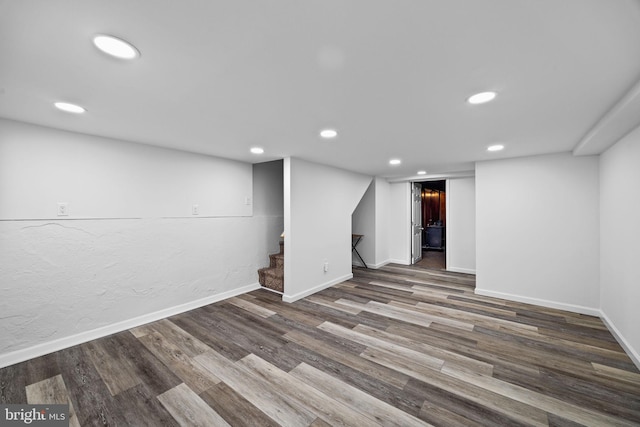 basement featuring hardwood / wood-style floors