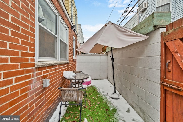 view of property exterior with an AC wall unit