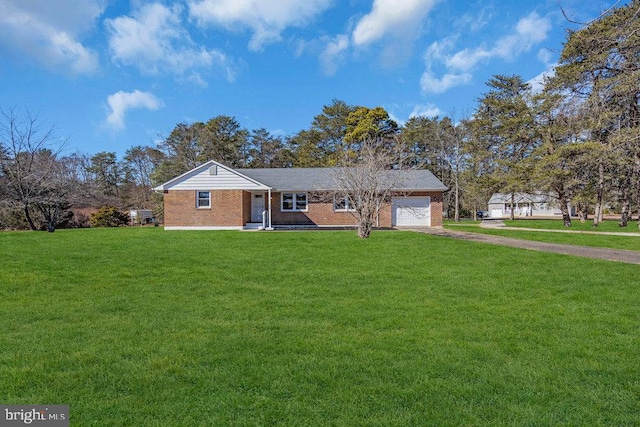 single story home featuring an attached garage, brick siding, driveway, and a front yard