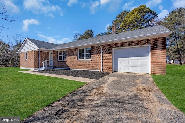 ranch-style home with a garage, brick siding, driveway, a front lawn, and a chimney