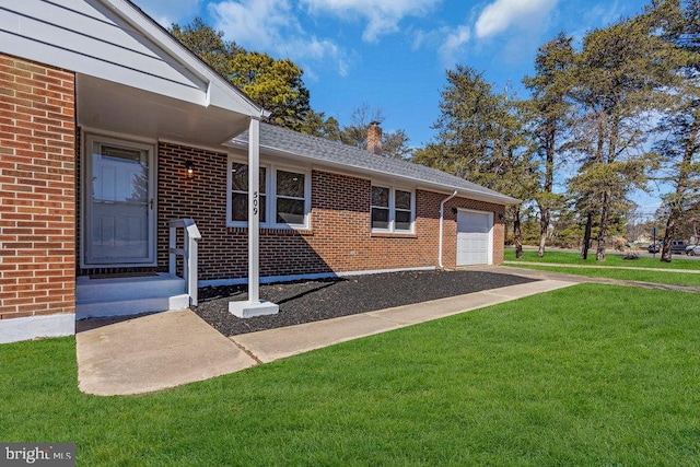 property entrance with an attached garage, a yard, and brick siding