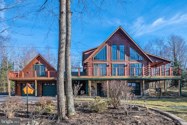 back of house featuring stone siding and log exterior