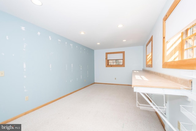 carpeted office space with recessed lighting and baseboards