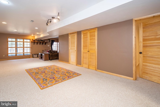 basement featuring visible vents, recessed lighting, carpet, and baseboards