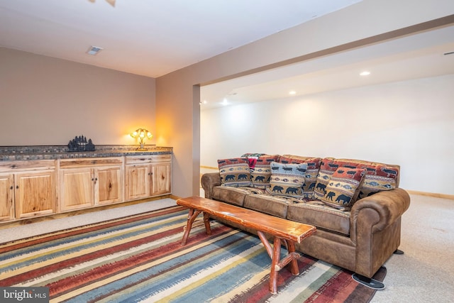 living area featuring light carpet, visible vents, recessed lighting, and baseboards