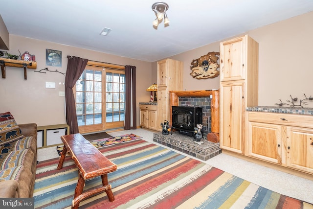 living room featuring light colored carpet and visible vents