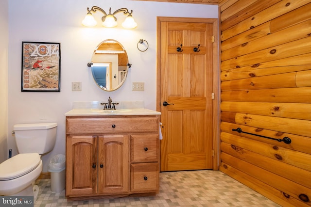 bathroom featuring tile patterned floors, toilet, and vanity