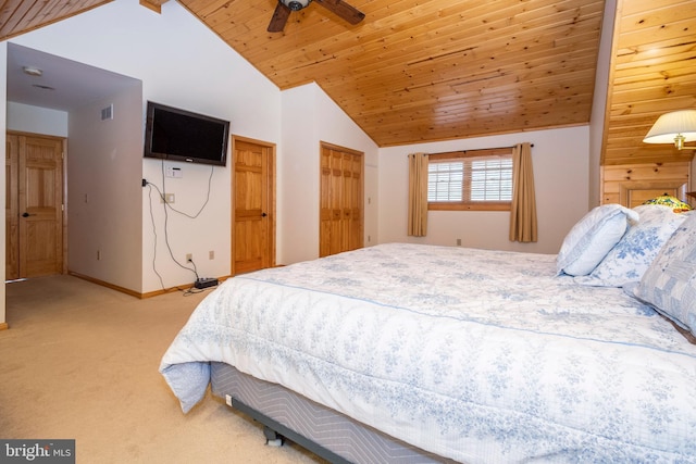 bedroom featuring carpet, baseboards, visible vents, high vaulted ceiling, and wooden ceiling