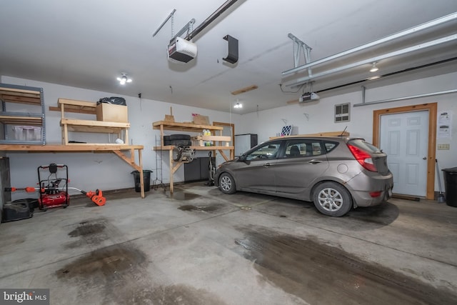 garage featuring a garage door opener