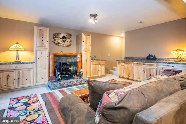 living area featuring stairway and light carpet