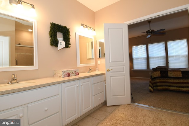 bathroom with tile patterned floors, lofted ceiling, ceiling fan, and vanity