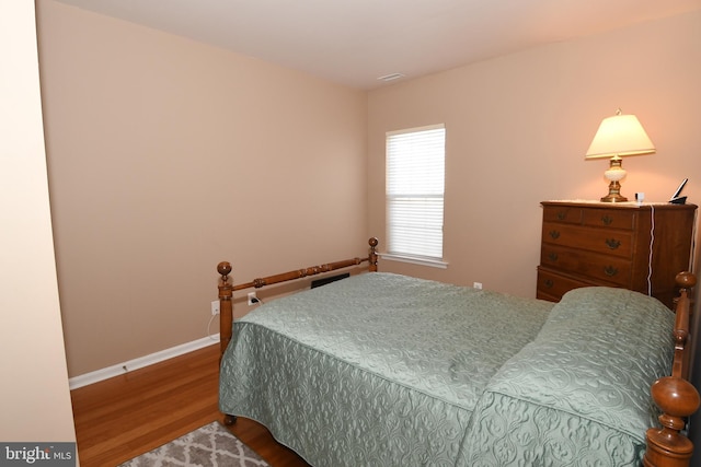 bedroom featuring hardwood / wood-style flooring