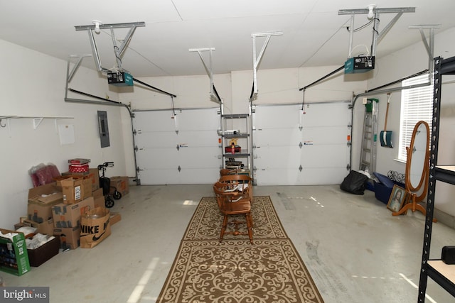 garage with a garage door opener and electric panel