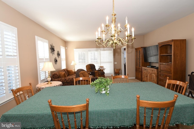 dining area with an inviting chandelier