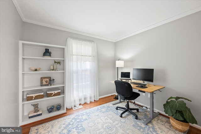 home office featuring ornamental molding, wood finished floors, visible vents, and baseboards