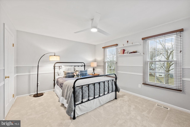 bedroom featuring carpet, visible vents, and baseboards