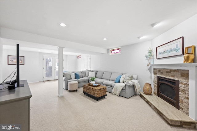 living room with carpet floors, recessed lighting, a fireplace, and baseboards