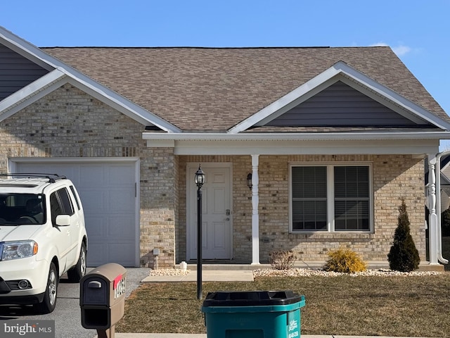 view of front of house featuring a garage and a front lawn