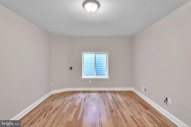 spare room with light hardwood / wood-style floors