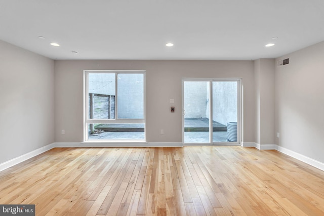 unfurnished room featuring light hardwood / wood-style flooring