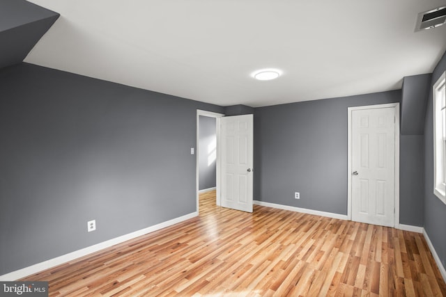 unfurnished bedroom featuring light wood-type flooring