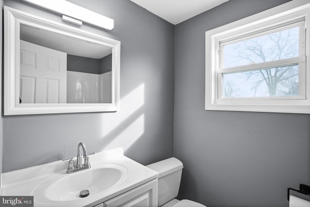 bathroom with vanity and toilet