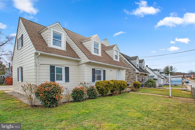 view of front of home with a front lawn