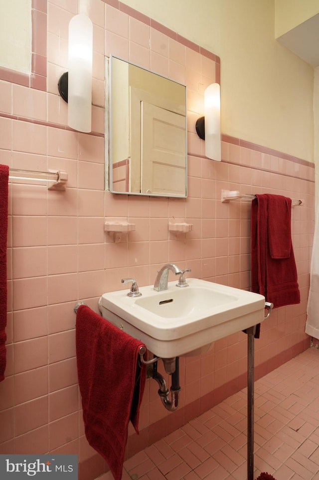 bathroom with tile walls