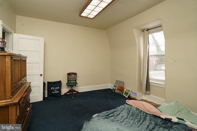 bedroom with carpet floors and baseboards