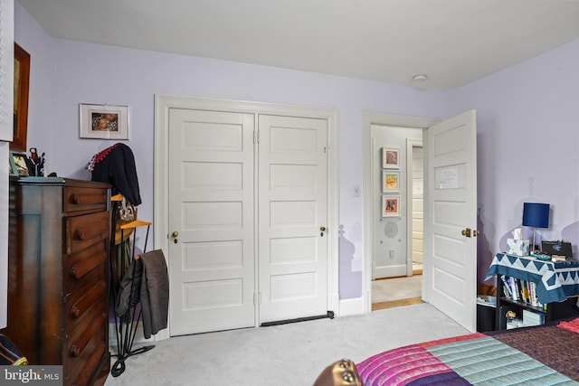 carpeted bedroom featuring a closet