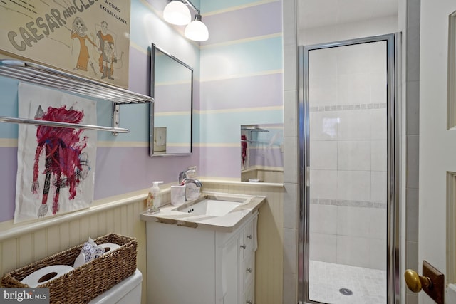 bathroom featuring vanity and an enclosed shower