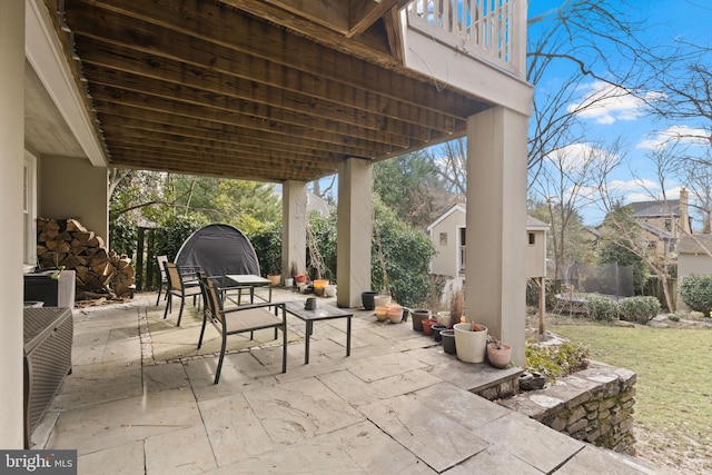 view of patio featuring a balcony