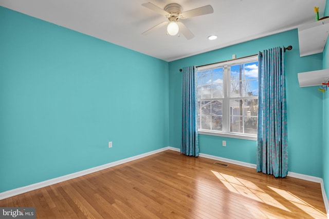 unfurnished room featuring ceiling fan and light wood-type flooring