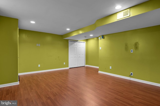 basement featuring hardwood / wood-style floors