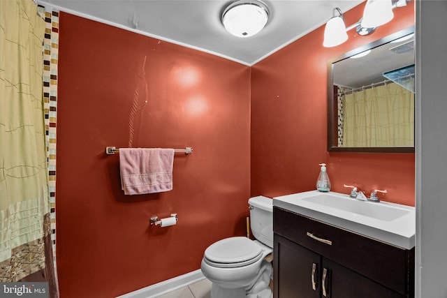 bathroom with vanity, tile patterned floors, and toilet