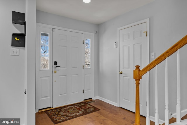 foyer entrance with light hardwood / wood-style floors