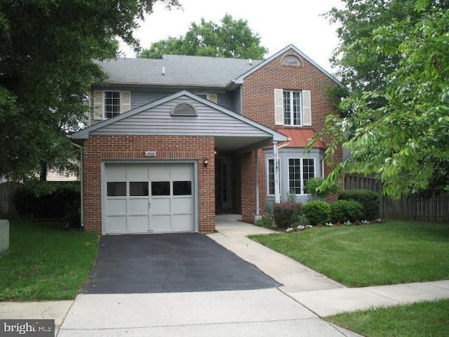 front of property featuring a garage and a front lawn