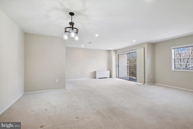 carpeted empty room with a wealth of natural light