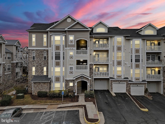 view of outdoor building at dusk