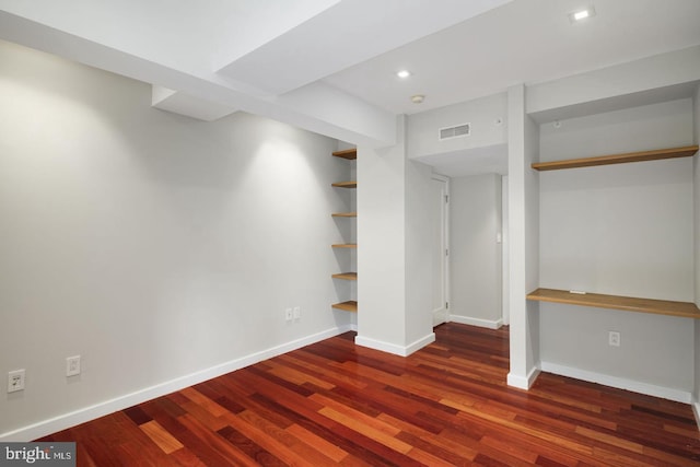 basement featuring dark wood-type flooring