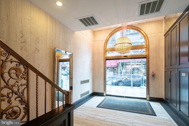 entrance foyer with a notable chandelier